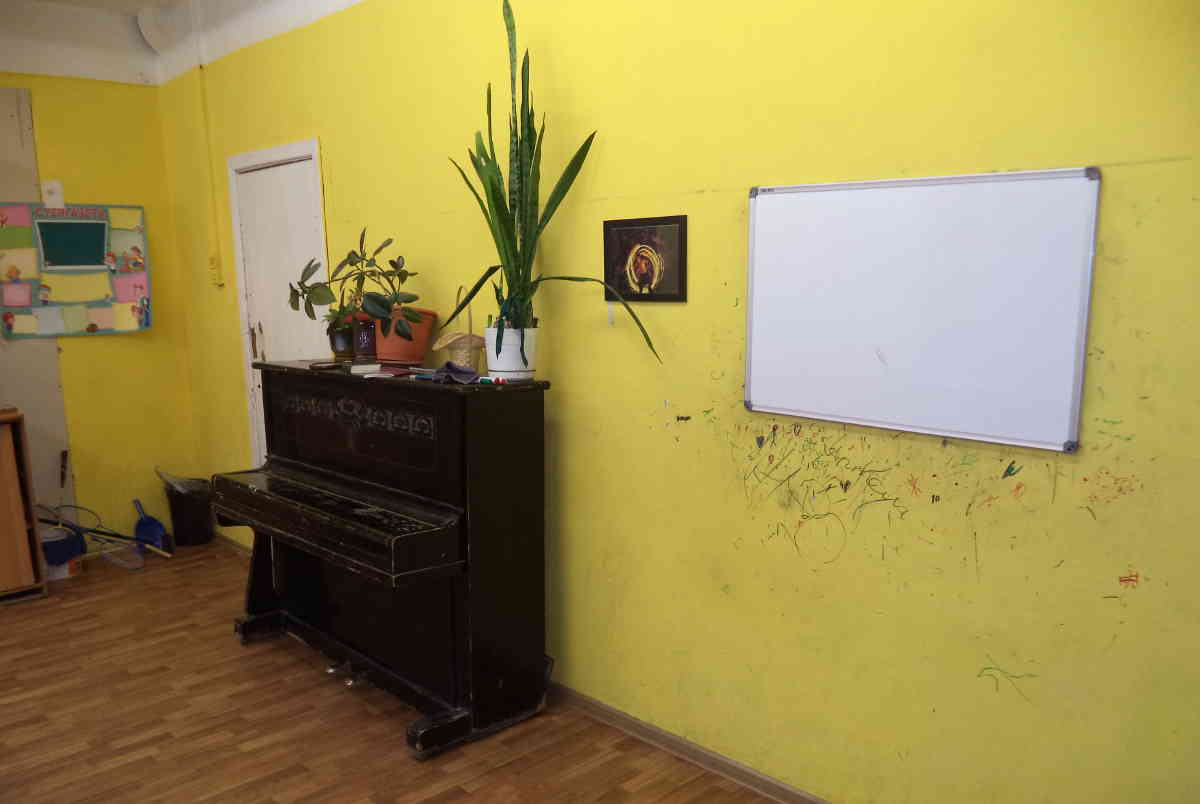 A piano in a Russian public school classroom